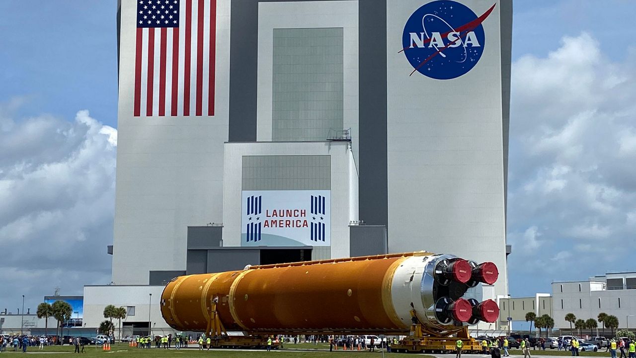 The core stage of the Artemis rocket pulls into the Vehicle Assembly Building at the Kennedy Space Center Thursday, where the Space Launch System will be assembled. (Spectrum News/Jon Shaban)