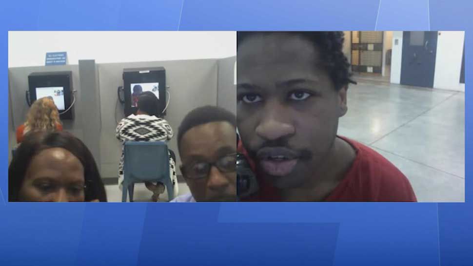 Screen shot from video released by the State Attorney's Office showing accused Seminole Heights killer Howell Donaldson III speaking to his parents during one of their visits to him in jail. (Spectrum Bay News 9)