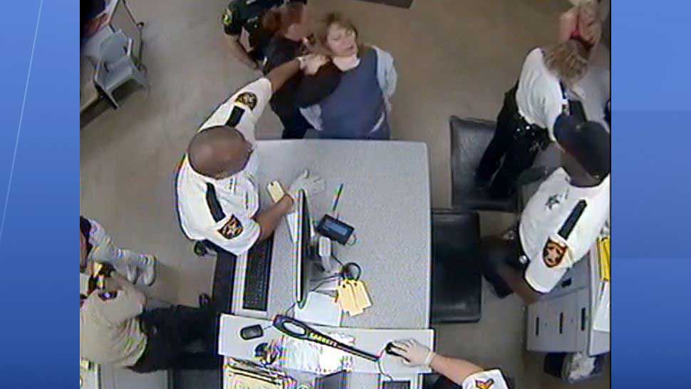 Screen shot taken from surveillance video showing former Pinellas detention deputy Amy Gee with her hand around the throat of an inmate in the process of slamming her down to the floor. The incident occurred on January 8, 2019. (Courtesy of Pinellas County Sheriff's Office)