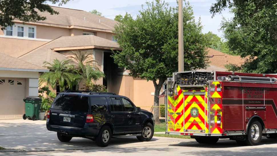 Pasco County Fire Rescue outside a home in Wesley Chapel where a fire broke out Sunday, April 14, 2019. A man was found dead inside the house, according to Fire Rescue officials. (Tim Wronka/Spectrum Bay News 9)