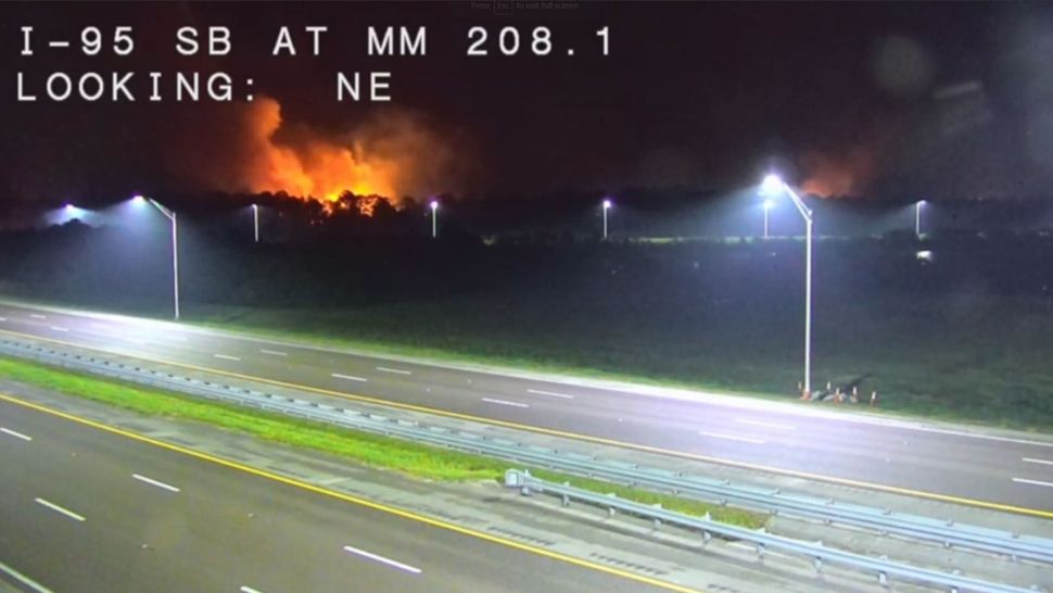 The fire erupted Wednesday night just east of Interstate 95, near Port St. John Parkway. (Florida Dept. of Transportation camera)