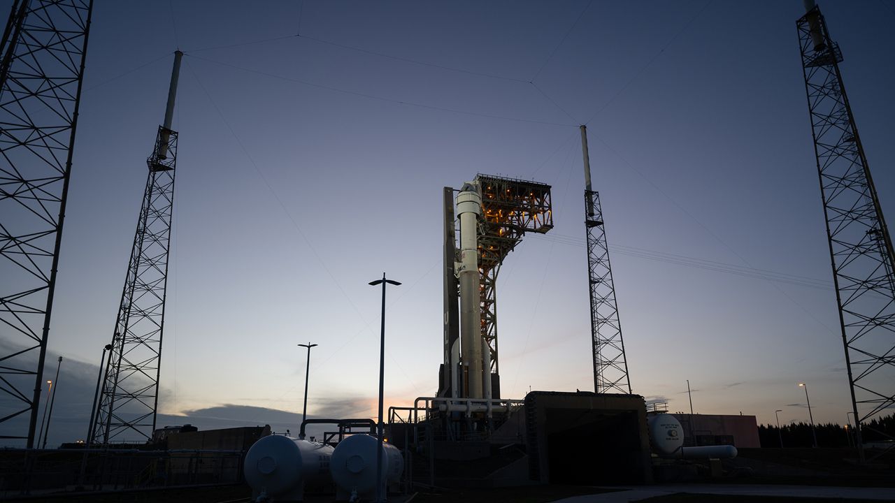 The Starliner spacecraft is seen sitting on top of the Atlas V rocket. A series of issues have plagued the maiden launch of the crewed Starliner mission and both the Starliner and Atlas V are in the Vertical Integration Facility at Space Launch Complex-41 on Cape Canaveral Space Force Station in Florida. (File Photo)