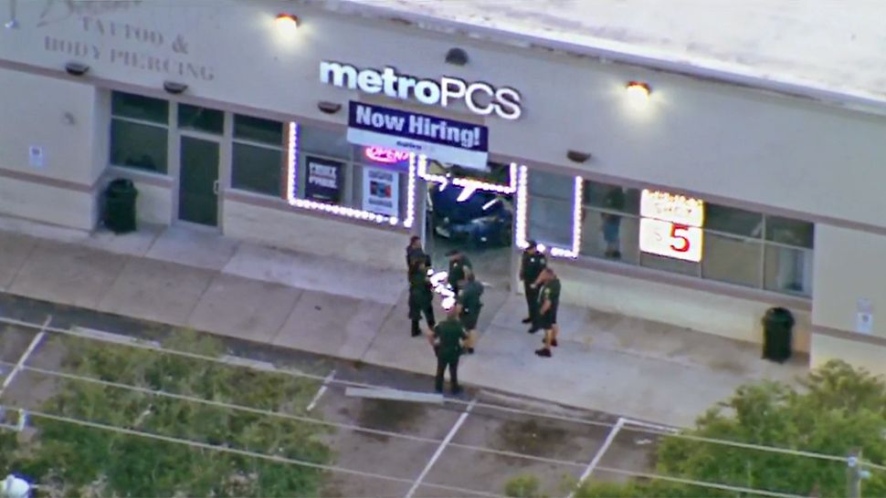 Car crashes into MetroPCS store in smash-and-grab robbery