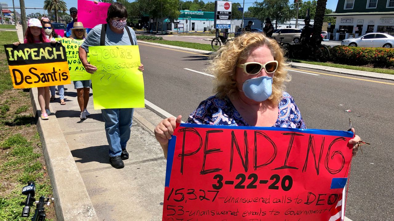 Many of the protesters Friday say they've run out of money and are living on credit cards and charity from relatives.​ They've gone six weeks without any unemployment benefits and say they're getting desperate. (Josh Rojas/Spectrum Bay News 9)