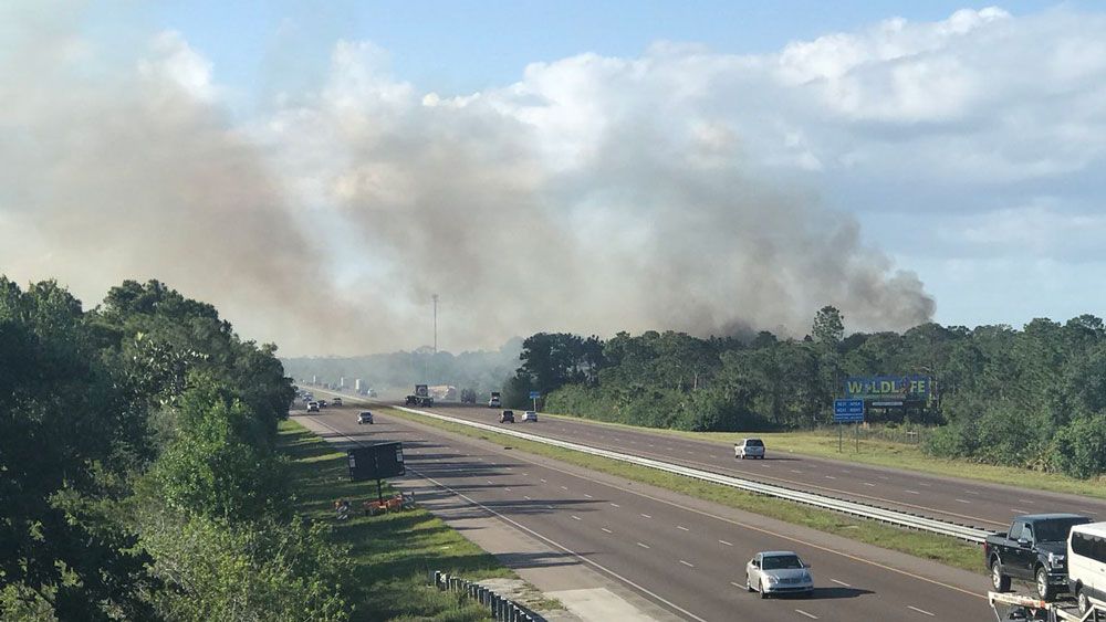 A brush fire is burning near I-95 in Grant-Valkaria. Several agencies are fighting the fire. (Greg Pallone, Staff)