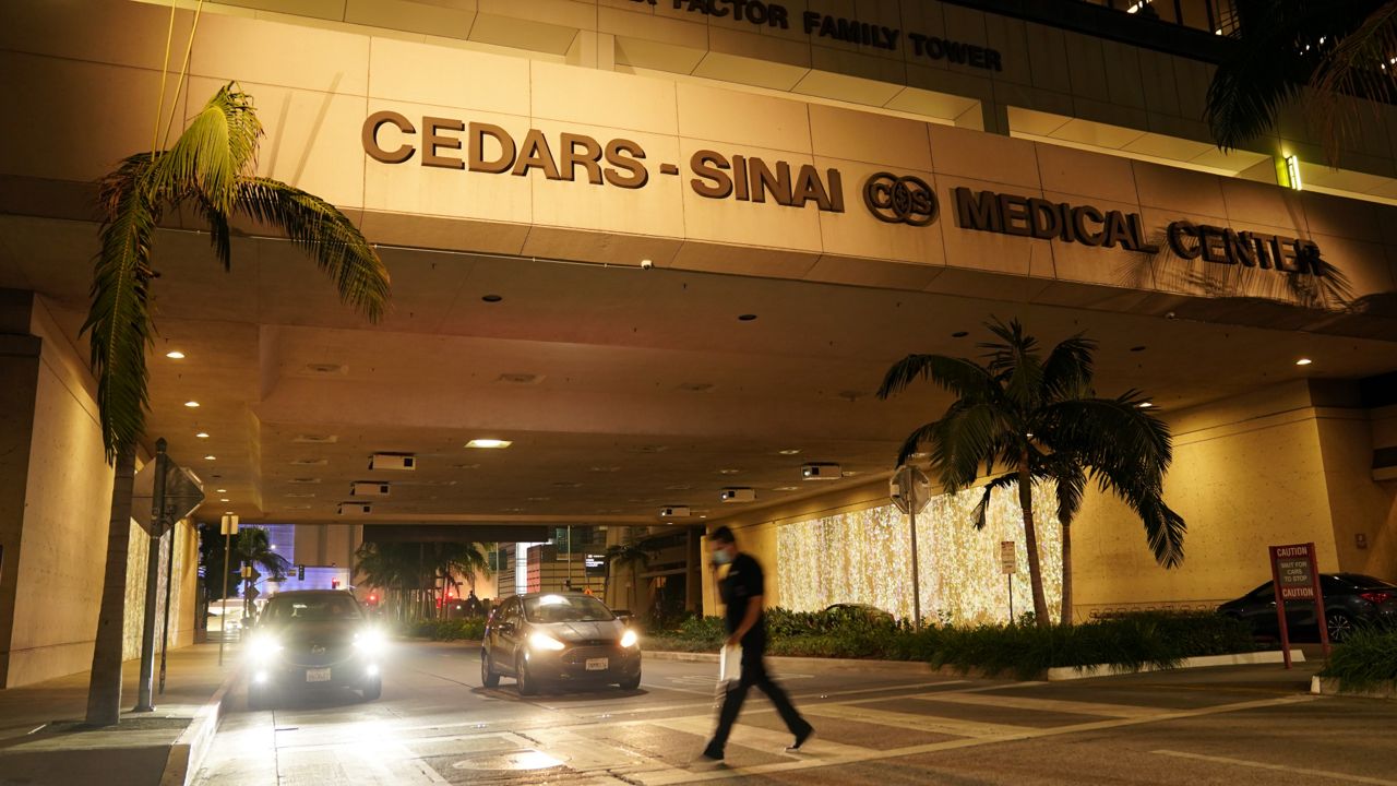 Cedars-Sinai Medical Center is pictured, late Tuesday, Jan. 5, 2021, in Los Angeles. (AP Photo/Chris Pizzello)