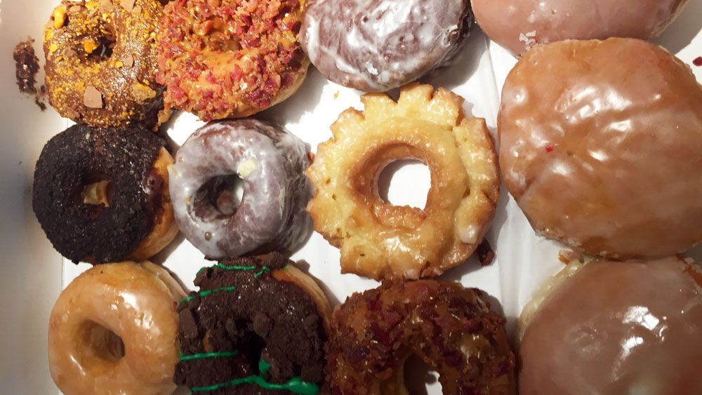 A selection of doughnuts from Donut King in Winter Park, including maple bacon, Butterfinger, Grasshopper, jelly filled and old-fashioned. (Christie Zizo, Staff)