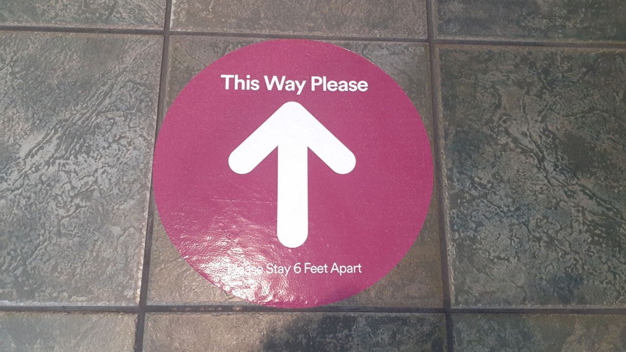 This sign was on the floor Monday at Tyrone Square Mall, which is among the shopping centers that reopened Monday. (Ashley Paul/Spectrum Bay News 9)