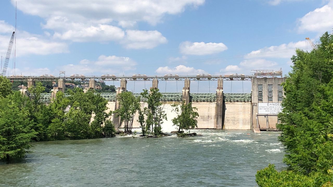 Photo of Tom Miller Dam with flood gate partially open on May 5, 2019 (Spectrum News)