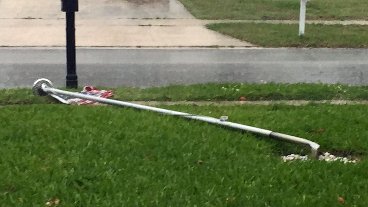 A flag pole bent after a storm swept through Largo.