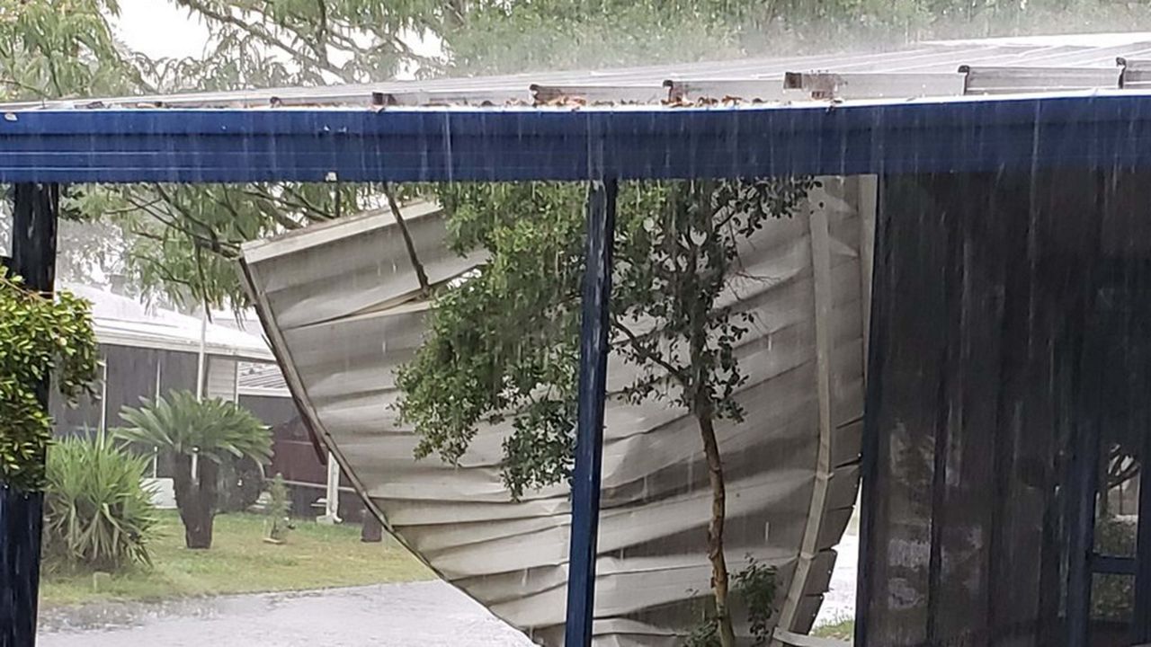 In Zephyrhills, strong winds blew this awning from a neighbor's home over another house. 