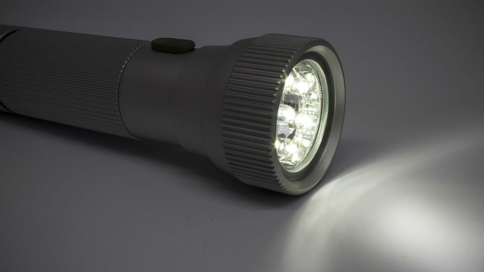 FILE photo of a flashlight in the dark. (Pixabay)