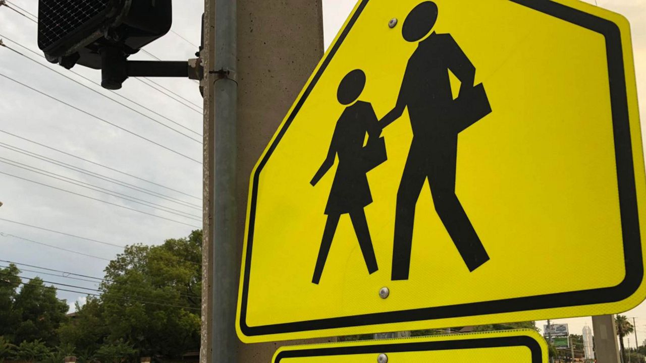 When JCPS students go back to school next week, on August 11, some won't have the help of a crossing guard. (Spectrum News 1)
