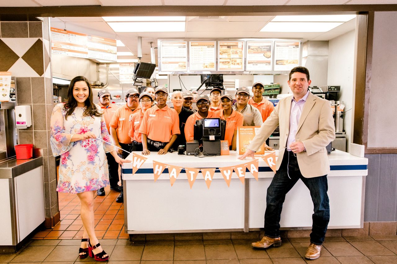 The couple poses with Whataburger staff thanking them for helping make their one year anniversary so tasty. (Courtesy: Madison Richard Photography)