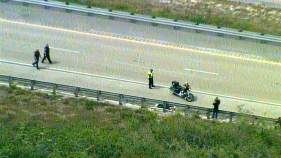 Investigators closed off both sides of the Beachline Expressway near the Industry Road exit Thursday afternoon after a Brevard County deputy on a motorcycle was injured in a crash. (Sky 13)