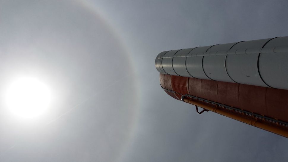 A dramatic sun halo shines over the Kennedy Space Center Visitor Complex on Thursday afternoon.