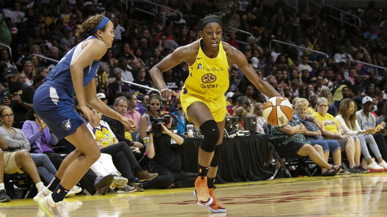 Los Angeles Sparks' Chiney Ogwumike (13) drives against Minnesota Lynx's Napheesa Collier (24) during a WNBA basketball game between Los Angeles Sparks and Minnesota Lynx in Los Angeles, Sunday, Sept. 8, 2019. (AP Photo/Ringo H.W. Chiu)