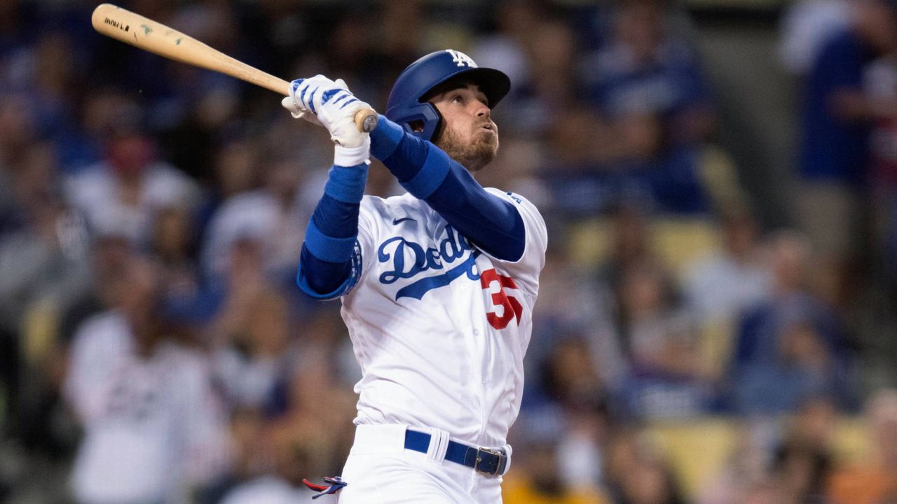 Los Angeles Dodgers' Cody Bellinger watches his solo home run during the third inning of the team's baseball game against the Philadelphia Phillies in LA on Thursday. (AP Photo/Kyusung Gong)