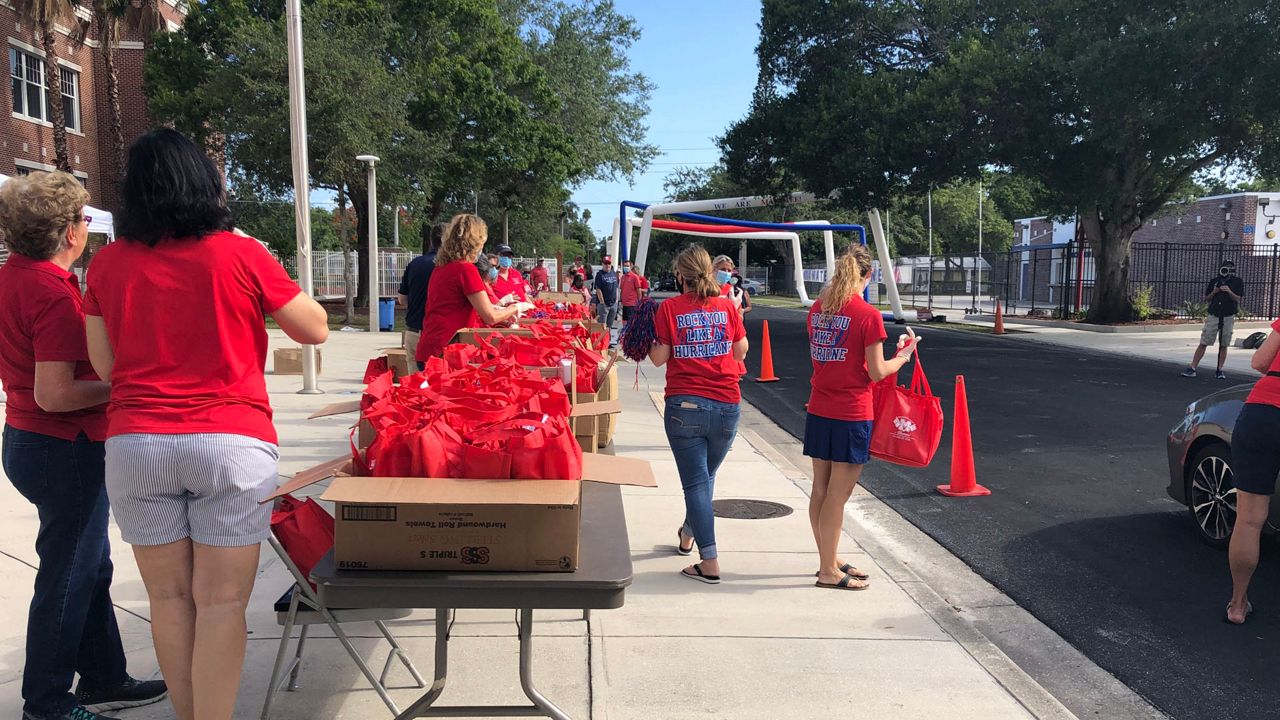 In Manatee County, graduations were originally scheduled to take place over the next few days. The ceremonies have now been pushed to mid-summer.  On Thursday at Manatee High School, teachers and administrators held an upbeat drive-by celebration for seniors picking up their cap and gowns. (Angie Angers/Spectrum Bay News 9)