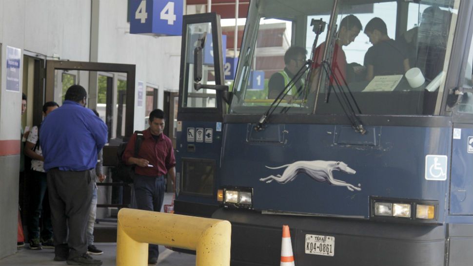 An asylum seeker from Guatemala board a Greyhound bus in El Paso, Texas, Tuesday, April 2, 2019. With immigrant processing and holding centers overwhelmed, the administration is busing people hundreds of miles inland and releasing them at Greyhound stations and churches in cities like Albuquerque, San Antonio and Phoenix because towns close to the border already have more than they can handle.(AP Photo/Cedar Attanasio)