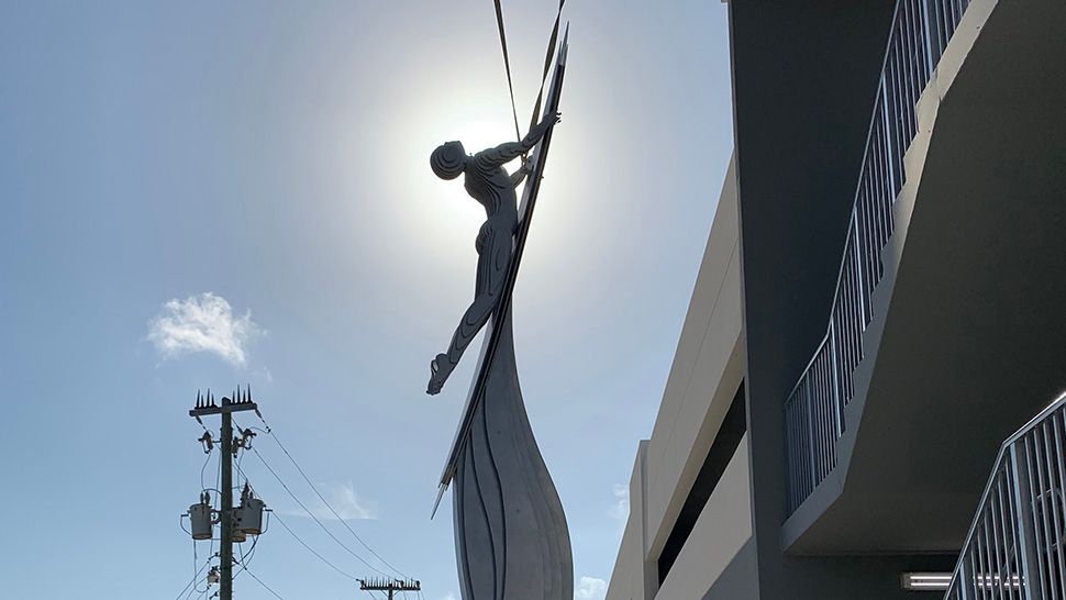 A new statue in Cocoa Beach depicts a surfer launching into space. (Greg Pallone/Spectrum News 13)