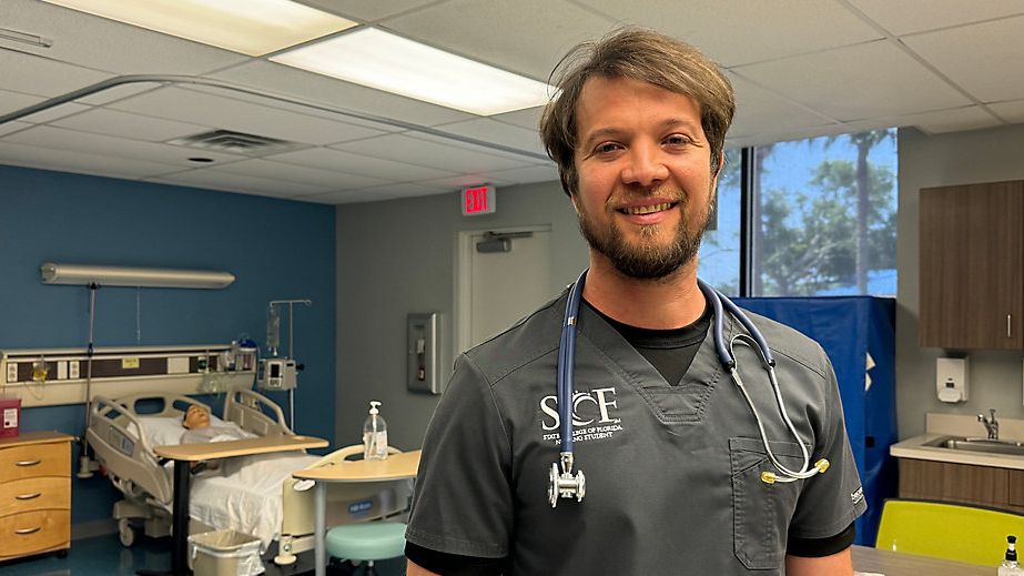 Carlos Alana stands in the skills lab at State College of Florida. (Spectrum Bay News 9/Julia Hazel)