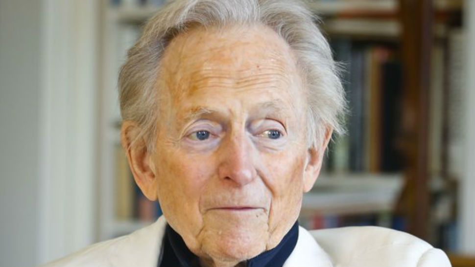 FILE - In this July 26, 2016 file photo, American author and journalist Tom Wolfe, Jr. appears in his living room during an interview about his latest book, “The Kingdom of Speech,” in New York. Wolfe died at a New York City hospital. He was 87. Additional details were not immediately available. (AP Photo/Bebeto Matthews, File)