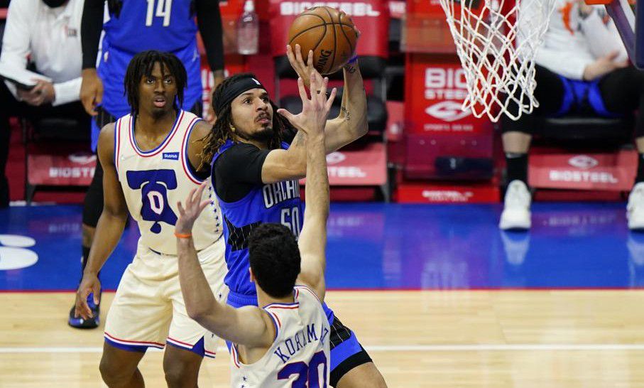 Orlando Magic's Cole Anthony (50) goes up for a shot against Philadelphia 76ers' Furkan Korkmaz (30) during the second half of an NBA basketball game, Sunday, May 16, 2021, in Philadelphia. (AP Photo/Matt Slocum)