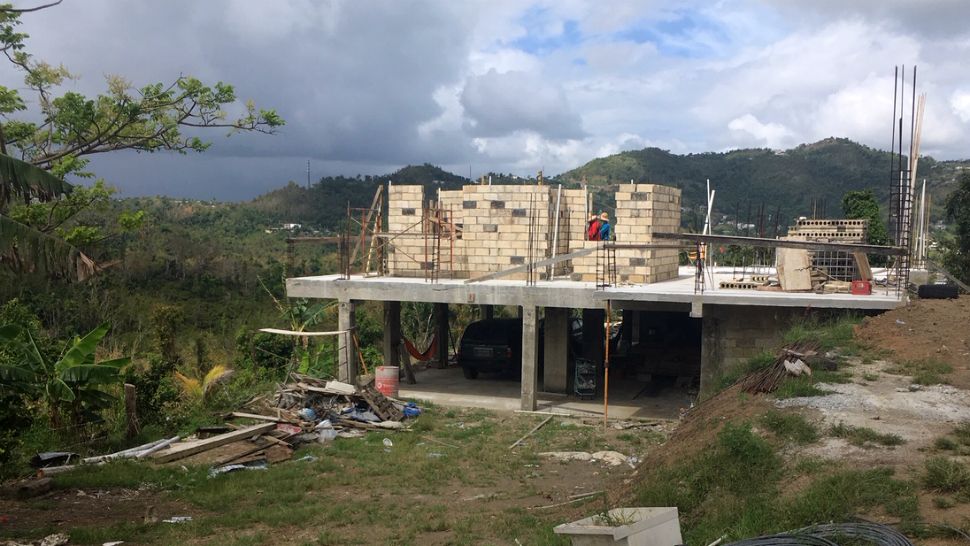 Noel Andres Gonzalez's new home in Canovanas, Puerto Rico, is still under construction. Despite their adversity, the 16-year-old says he's grateful to have been brought closer to his family. (Spectrum News)