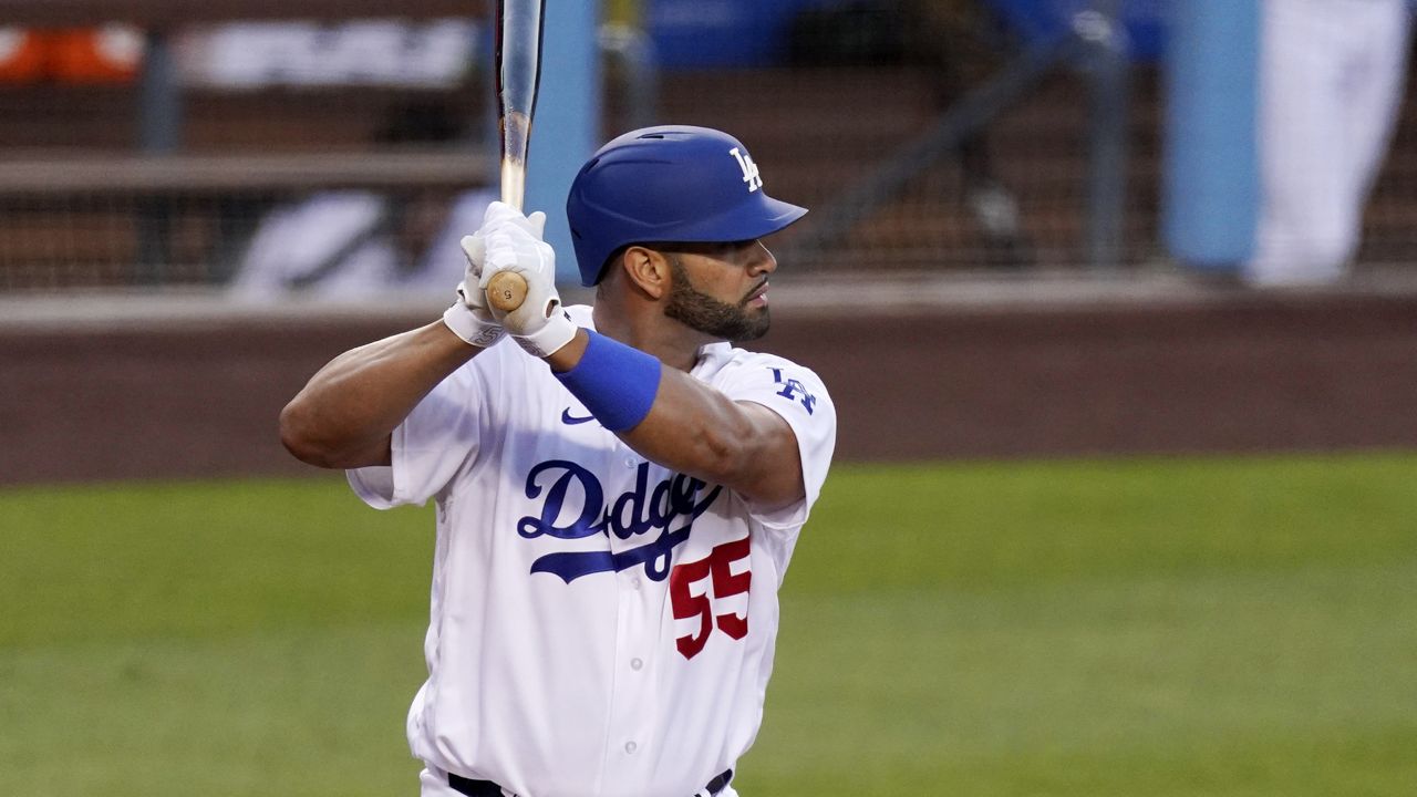 Los Angeles Dodgers' Albert Pujols bats during the first inning of a baseball game against the Arizona Diamondbacks Monday, May 17, 2021, in Los Angeles. (AP Photo/Mark J. Terrill)