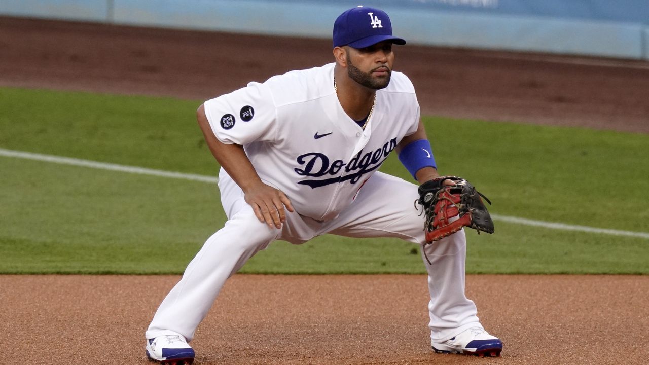Los Angeles Dodgers first baseman Albert Pujols gets set during the first inning of a baseball game against the Arizona Diamondbacks Monday, May 17, 2021, in Los Angeles. (AP Photo/Mark J. Terrill)