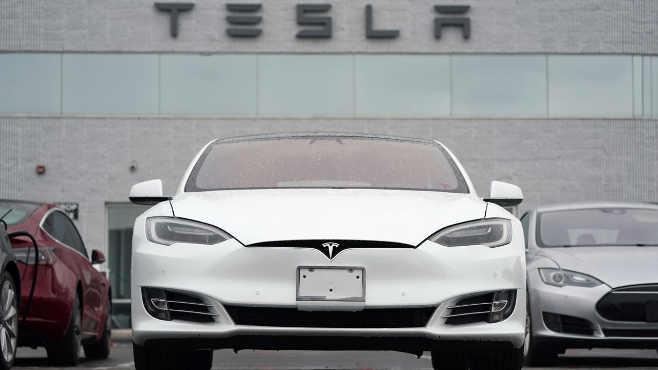 In this Sunday, May 9, 2021, photograph, an unsold S70 sedan sits at a Tesla dealership in Littleton, Colo. (AP Photo/David Zalubowski)