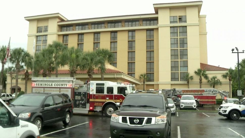 Firefighters respond to the Embassy Suites in Altamonte Springs on Thursday afternoon after a report of children "hanging" 50 feet up. (Ruben Almeida, staff)