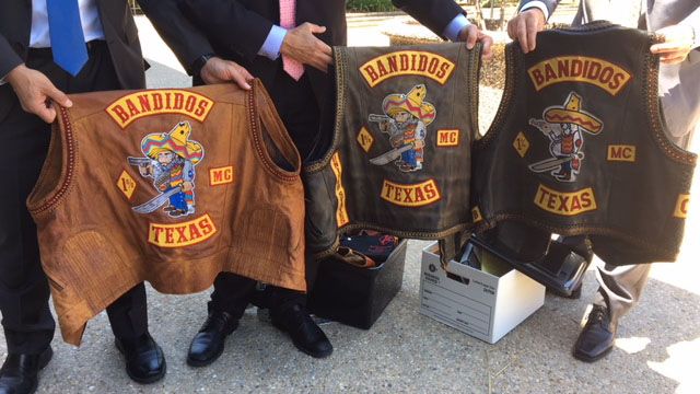 Prosecutors hold up Bandidos' vests on May 17, 2018. Courtesy/Alese Underwood