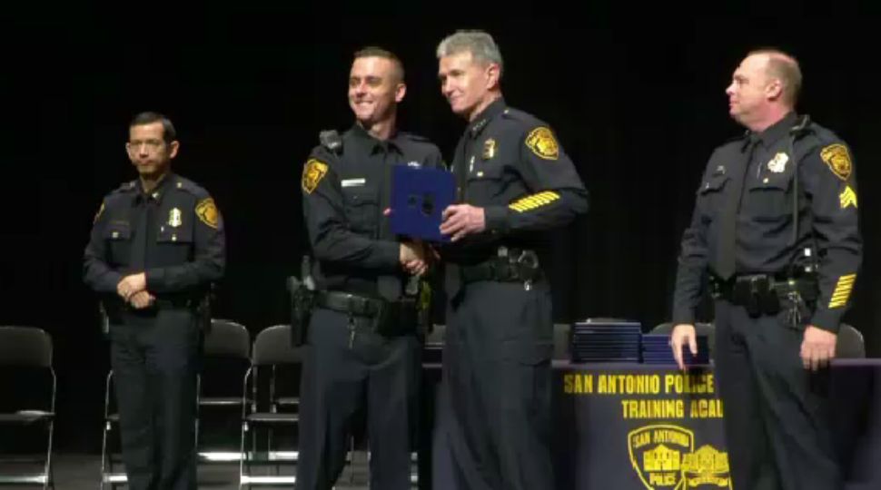 One graduate of the Cadet Class of 2018-D receiving his certificate from Chief William McManus of the San Antonio Police Department May 17, 2019 (Spectrum News)