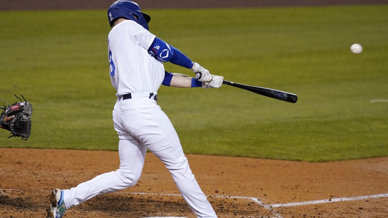 Los Angeles Dodgers' Gavin Lux hits a grand slam during the seventh inning of a baseball game against the Arizona Diamondbacks Tuesday, May 18, 2021, in Los Angeles. (AP Photo/Mark J. Terrill)