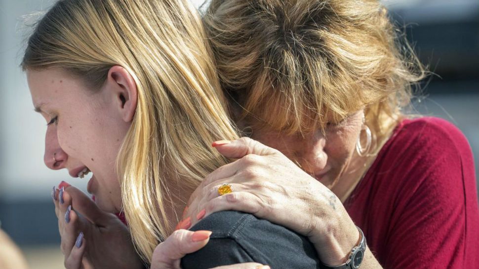 Santa Fe High School student Dakota Schrader is comforted by her mother Susan Davidson following the shooting on May 18, 2018. (Stuart Villanueva/The Galveston County Daily News via AP)