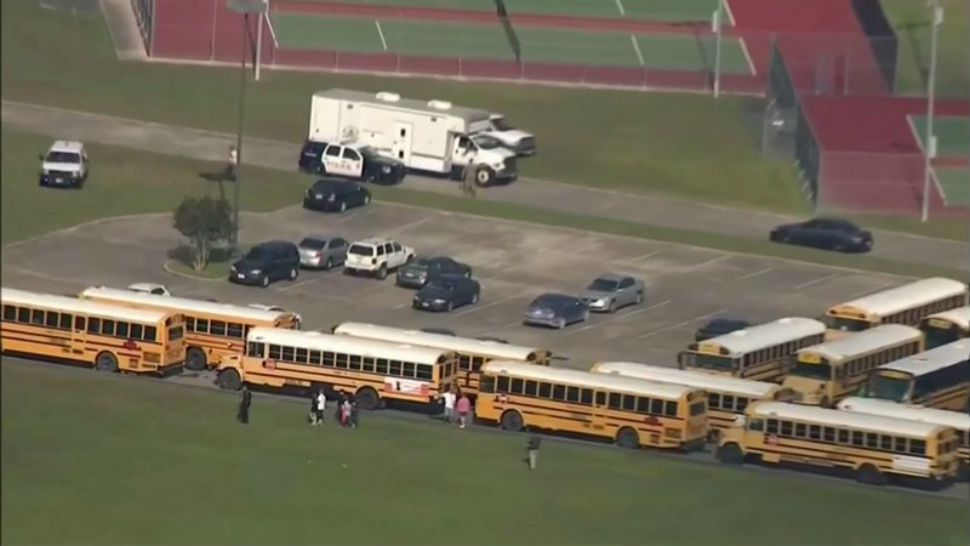 Emergency personnel, ambulances and helicopters are seen after reports of multiple dead at Santa Fe High School in Houston following a shooting on Friday, May 18, 2018. (CNN affiliate) 