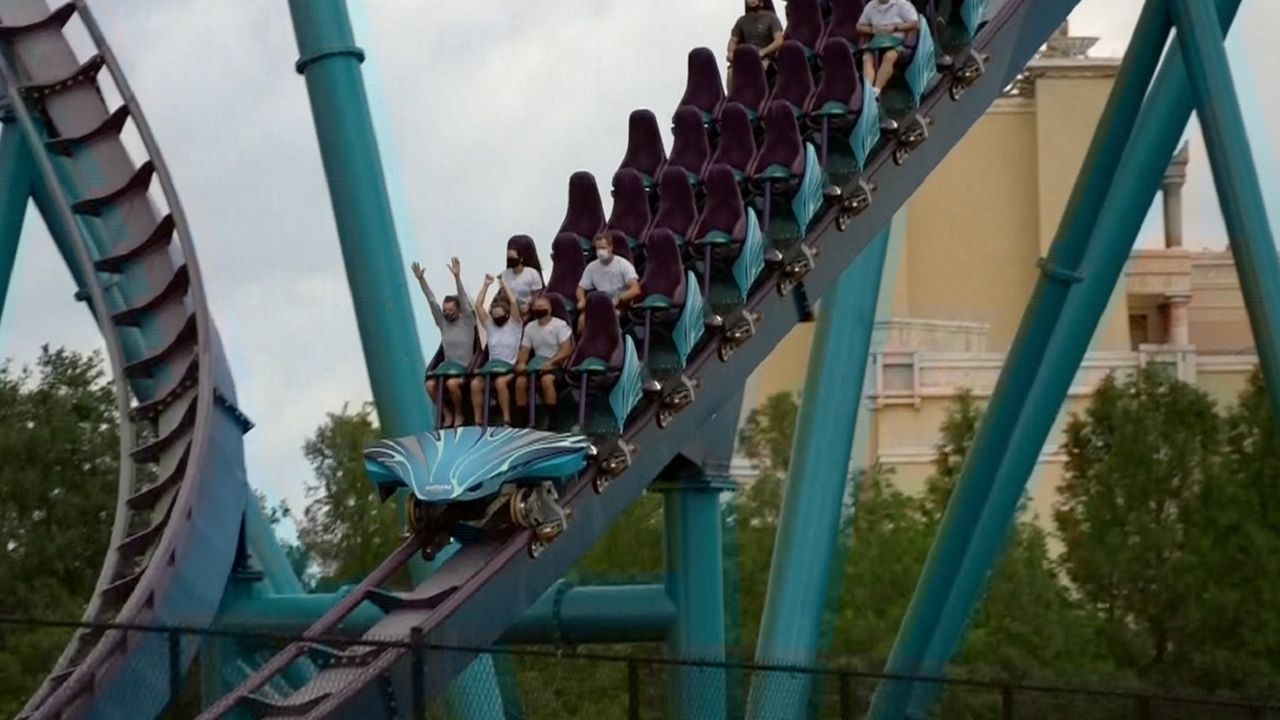 Masked riders on Mako during a test run at SeaWorld Tuesday. (Courtesy of Midway Mayhem)