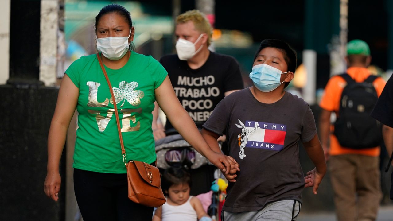 People wear masks in New York City during the COVID-19 pandemic. (AP Photo, File)