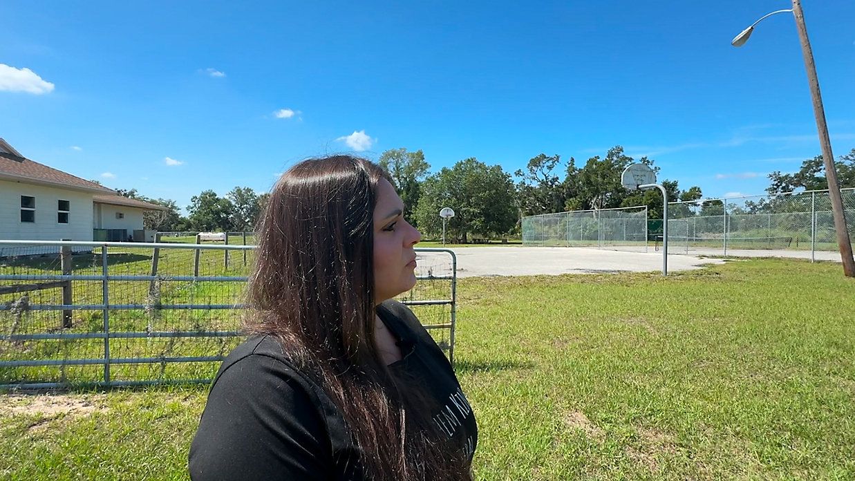 Lindsey Leigh stands on the property of Old Miakka Church. (Spectrum Bay News 9/Julia Hazel)
