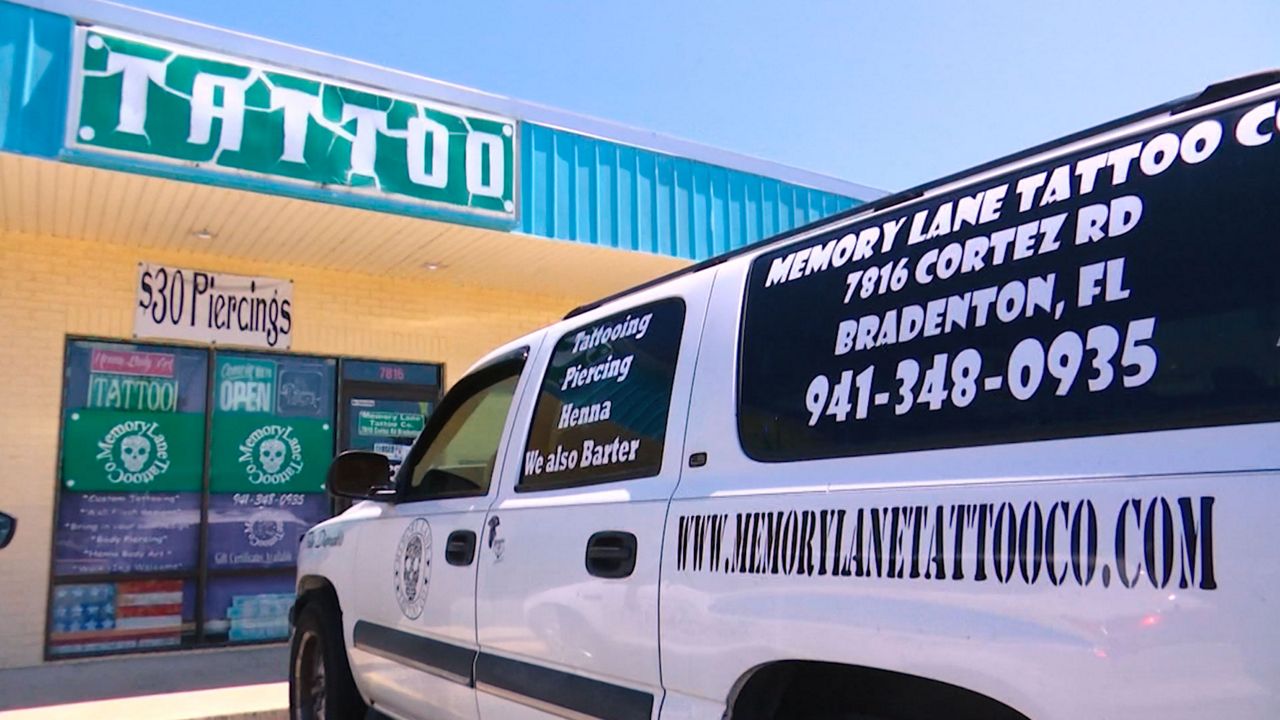 Vehicle parked in front of Memory Lane Tattoo Company in Bradenton. (Adria Iraheta/Spectrum Bay News 9)