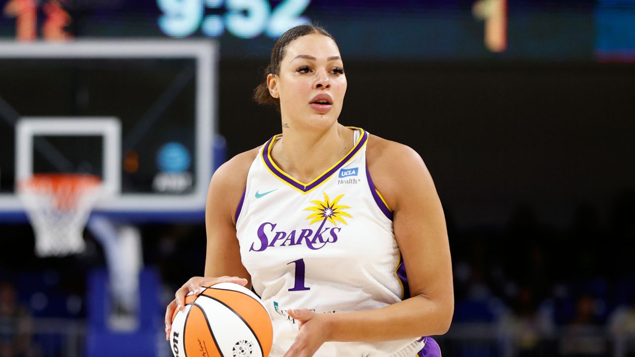 Los Angeles Sparks center Liz Cambage brings the ball up court against the Chicago Sky during the first half of the WNBA basketball game, Friday, May 6, 2022, in Chicago. (AP Photo/Kamil Krzaczynski)