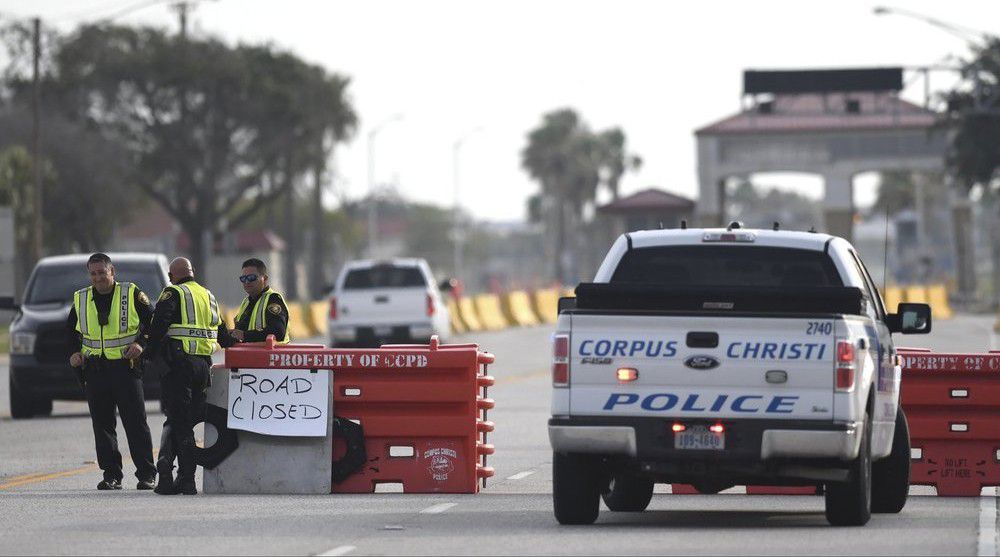 The entrances to the Naval Air Station-Corpus Christi are closed following an active shooter threat, Thursday, May 21, 2020, in Corpus Christi, Texas. Naval Air Station-Corpus Christi says the shooter was "neutralized" and the facility is on lockdown. (Annie Rice/Corpus Christi Caller-Times via AP)