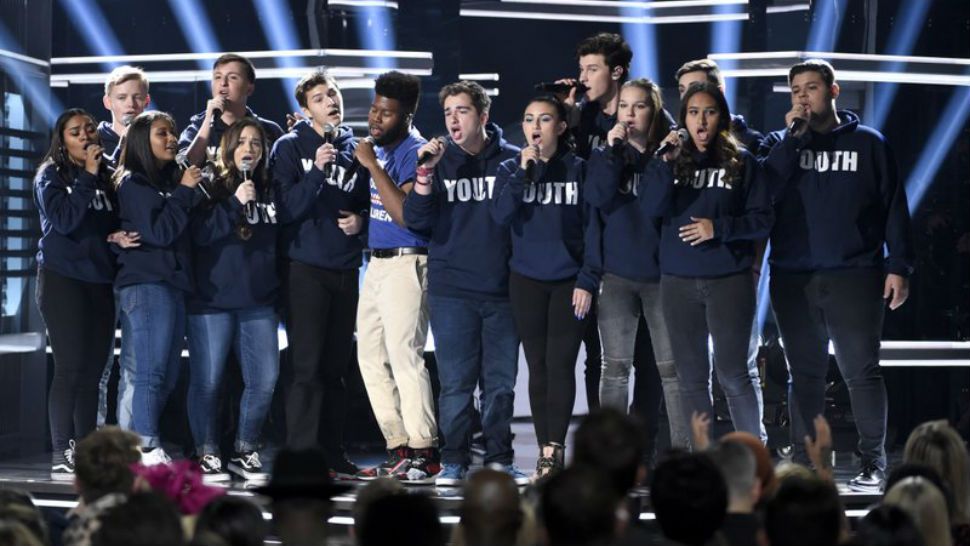 Khalid, seventh from left, and Shawn Mendes, fifth from right, perform “Youth” with the Stoneman Douglas choir, of the Marjory Stoneman Douglas High School, at the Billboard Music Awards at the MGM Grand Garden Arena on Sunday, May 20, 2018, in Las Vegas. (Photo by Chris Pizzello/Invision/AP)
