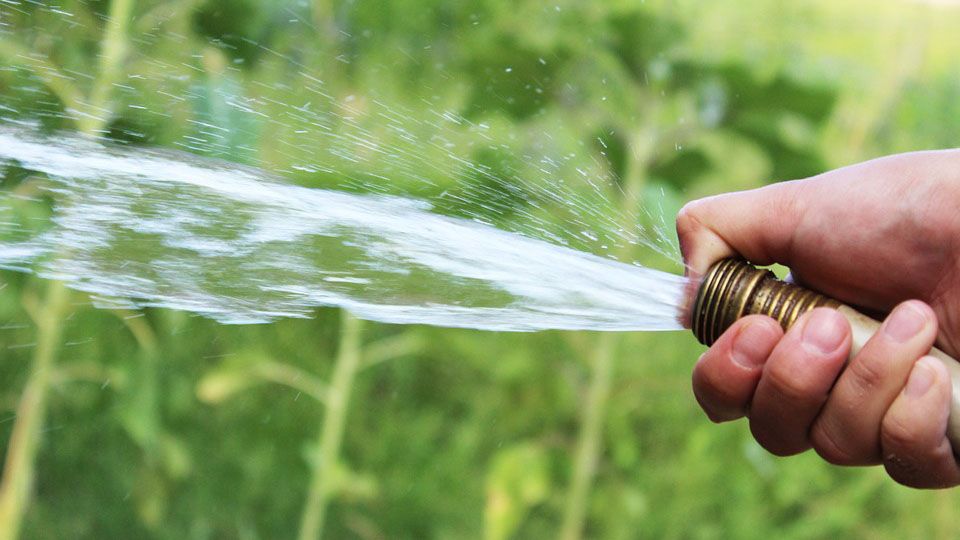 FILE- Water shoots out of hose. 