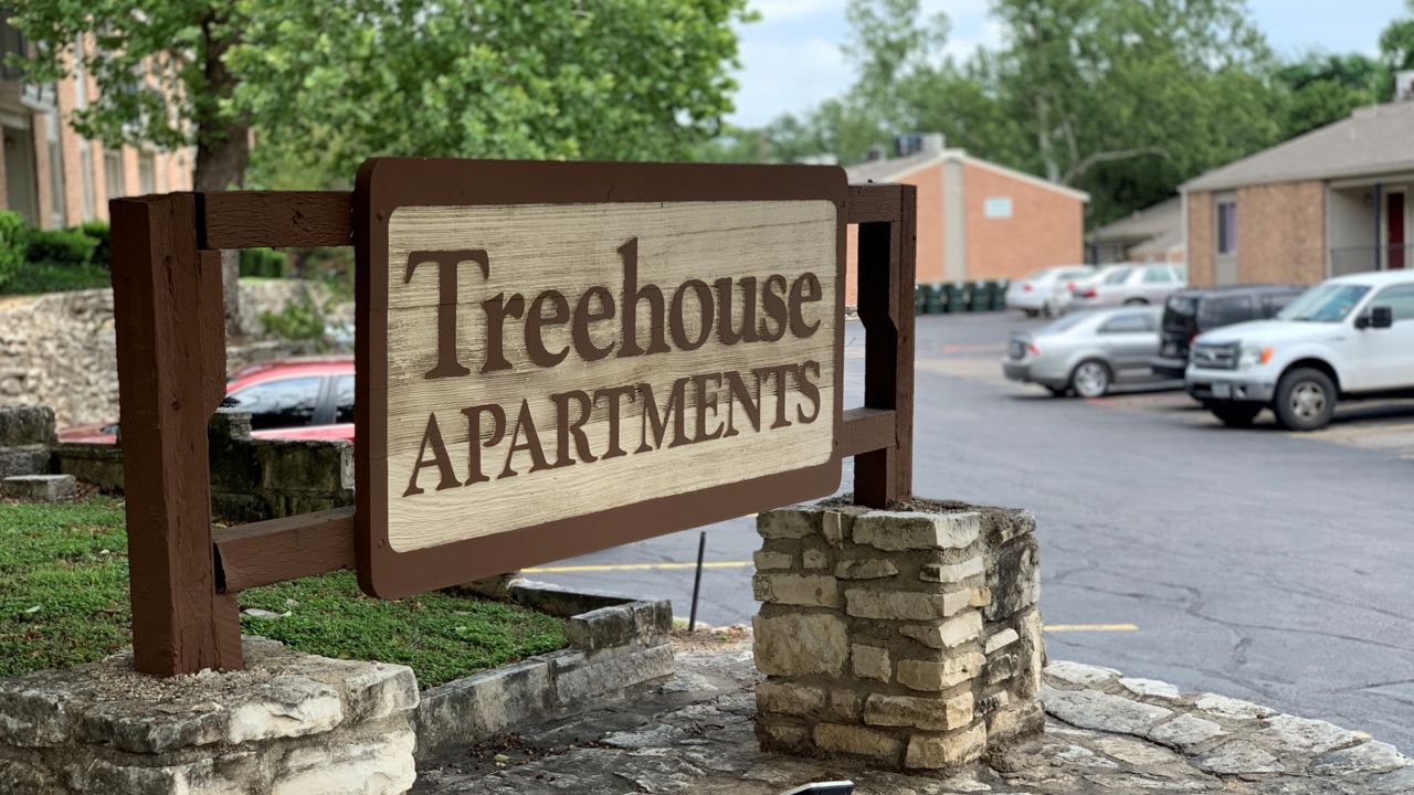 Photo of a sign at Treehouse Apartments (Spectrum News)