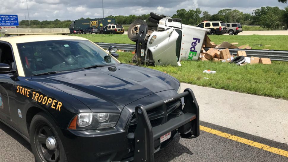 A FedEx driver lost control after a tire blew out on Interstate 4 on Tuesday, troopers said. The driver was killed. (Florida Highway Patrol)