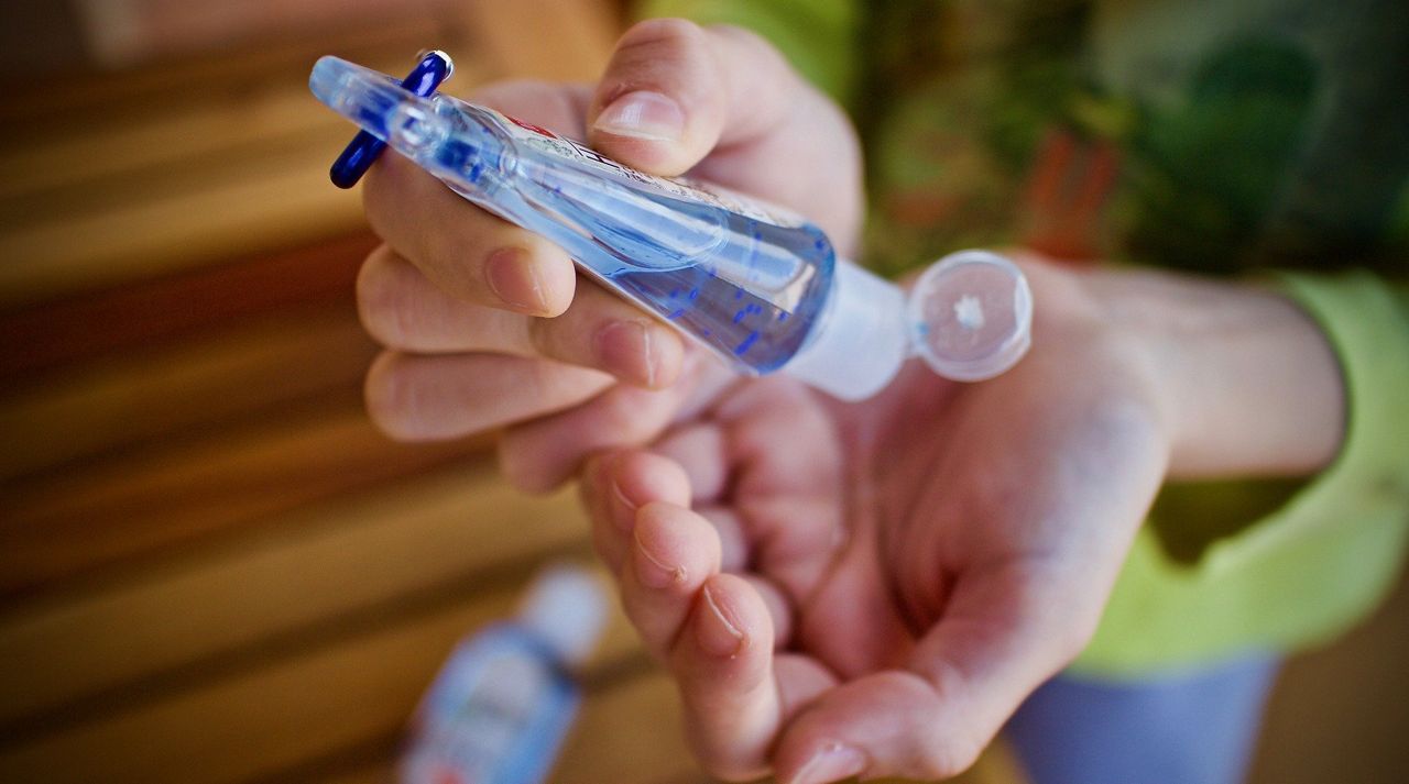 A person squeezes hand sanitizer into their hands (Stock image)