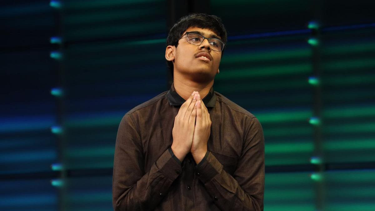 Nihar Janga reacts with prayer after winning the National Geographic GeoBee on May 22, 2019